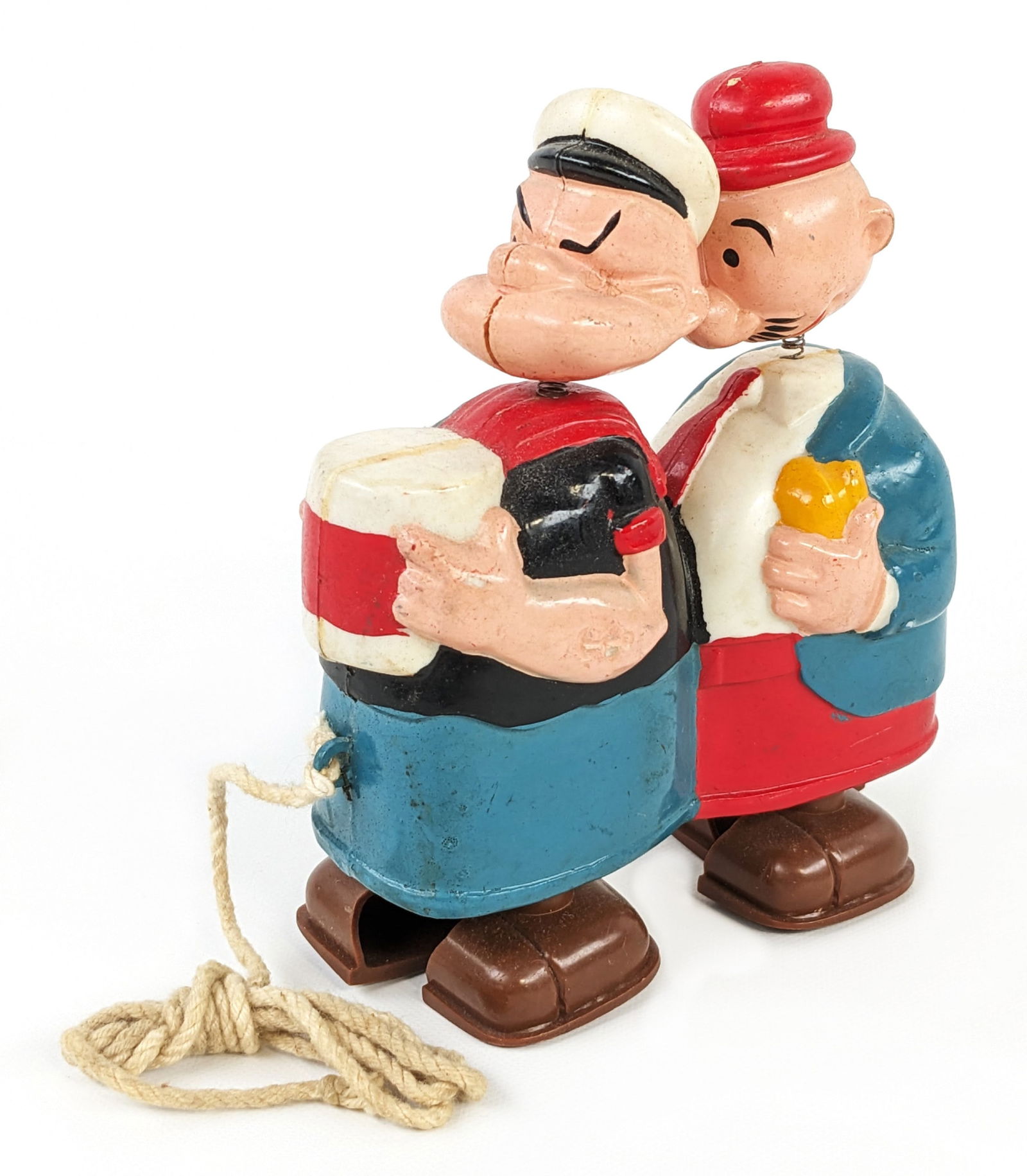 Marx Popeye and Wimpy Ramp Walker Pull Toy: Marx Popeye and Wimpy ramp walker pull toy. The pull string was replaced. The toy is in good working order. It does have some light play wear. Measures approximately 5" tall.