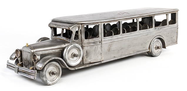 Buddy L Passenger Bus: Buddy L passenger bus. The bus was stripped to prepare for a restoration. It honestly displays very well as it sits. Also a great candidate for a restoration or custom project. The front bumper has be