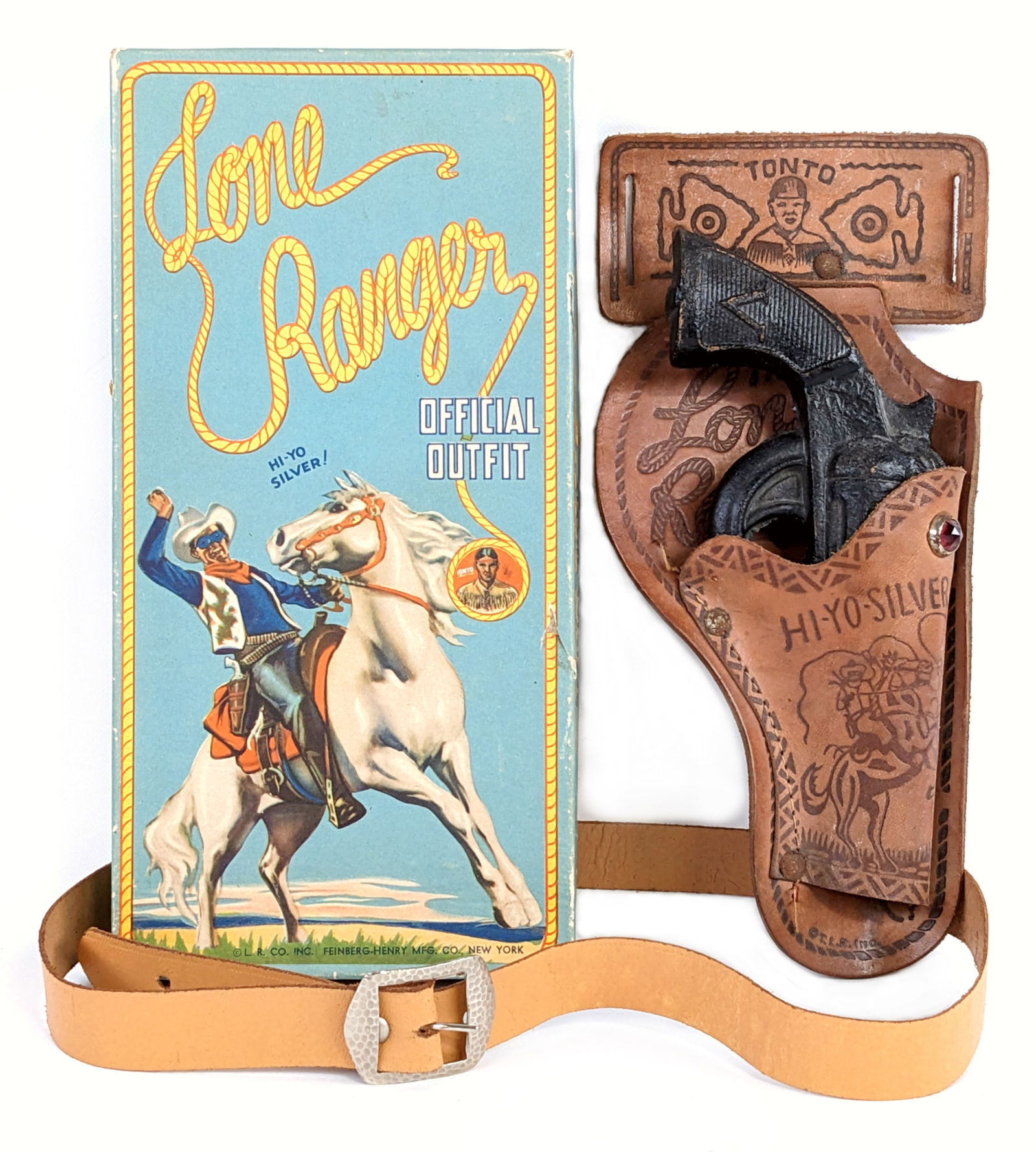 The Lone Ranger Official Outfit w/ Gun & Holster In Box: Circa 1930's Lone Ranger official outfit in original box. Includes a composite gun, leather holster, and three wood bullets. The box has a tiny puncture and a small scrape on the side. Overall a great