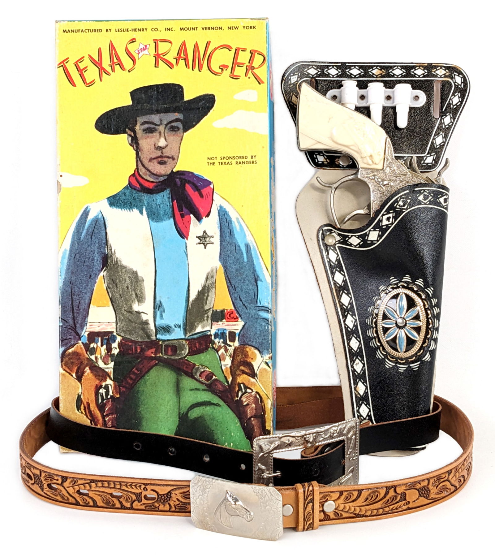 Leslie Henry Texas Ranger Star Cap Gun & Holster Set In Box: Leslie-Henry Texas Star Ranger cap gun and holster set in original box. The gun shows minor use wear and the holster has minor discoloration. Comes in a nice colorful box. Overall an excellent set. Th