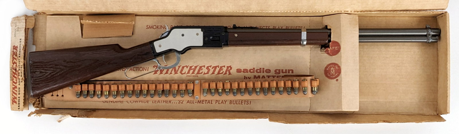 Mattel Winchester Saddle Gun w/ 32 Bullet Bandolier In Box: Mattel official Winchester saddle gun with 32 bullet bandolier in original box. The gun is in great shape with some minor rub marks. It comes complete with the belt and all the bullets. The box has th