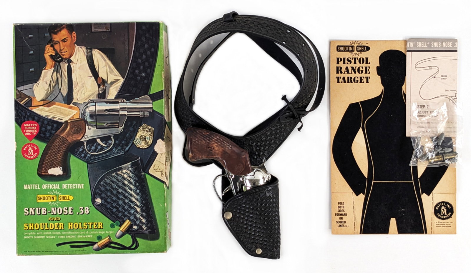 Mattel Shootin' Shell Snub-Nose .38 and Shoulder Holster In Box: Mattel official detective shootin' shell Snub-Nose .38 and shoulder holster set in original box. It includes a target and original instructions sheet. It is missing the wallet, badge, and ID card. The