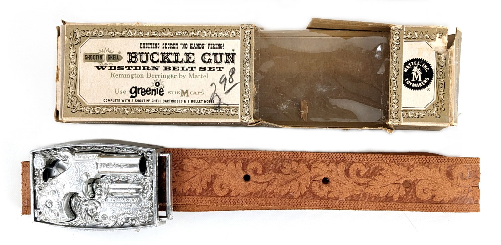 Mattel Shootin Shell Buckle Gun Western Belt Set In Box: Mattel Shootin' Shell buckle gun western belt set in original box. It comes with the original instructions sheet. The gun and belt are in excellent condition. The box has loose small flaps and some we