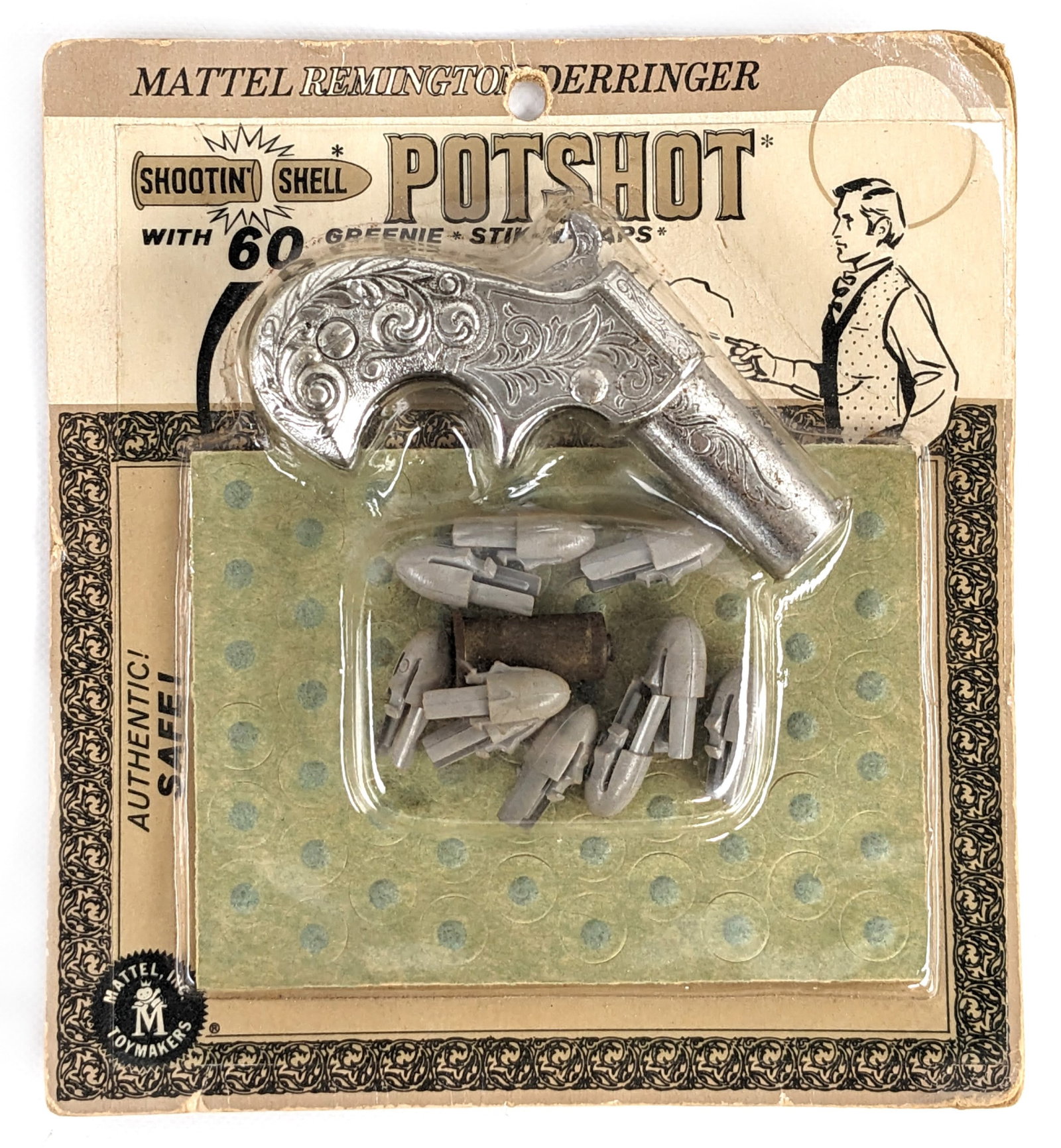 Mattel Shootin' Shell Potshot w/ Greenie Stik-M-Caps In Package: Mattel Remingtoy Derringer Shootin' Shell Potshot gun with 60 Greenie Stik-M-Caps. The package has some warping. Near mint on unopened card. Excellent condition. The package measures 5-1/2" tall by 5"