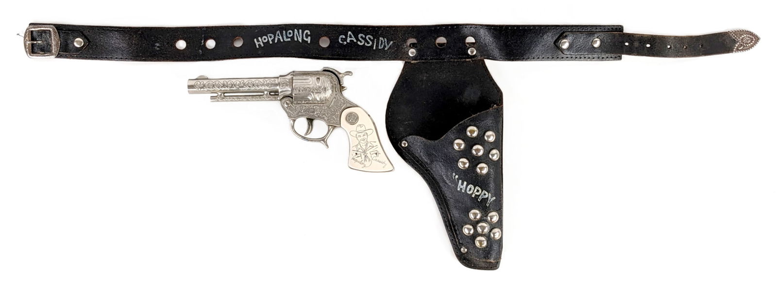 Wyandotte Toys Hopalong Cassidy Cap Gun w/ Holster: Wyandotte Toys Hopalong Cassidy cap gun with Hopalong Cassidy leather holster. The cap gun has minor corrosion on the hammer, but otherwise excellent working condition. The holster has some color loss