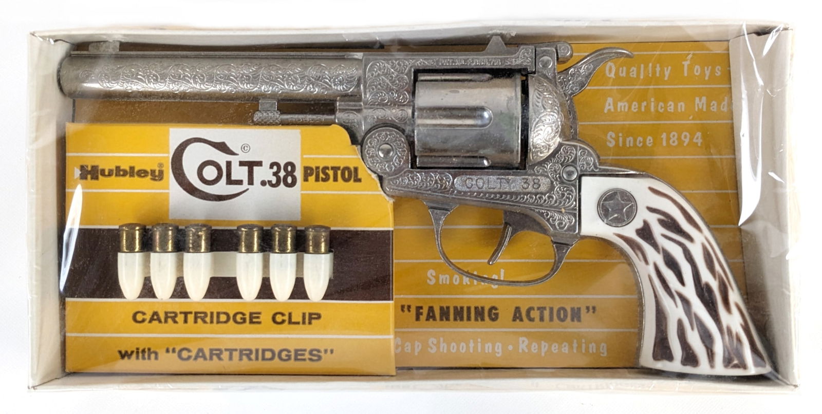 Hubley Colt .38 Pistol Cap Gun New In Original Box: Very nice Hubley Colt .38 pistol cap gun in original box. The box has the original plastic wrap. Very excellent condition and would be near impossible to upgrade. Measures approximately 10-1/2" long.