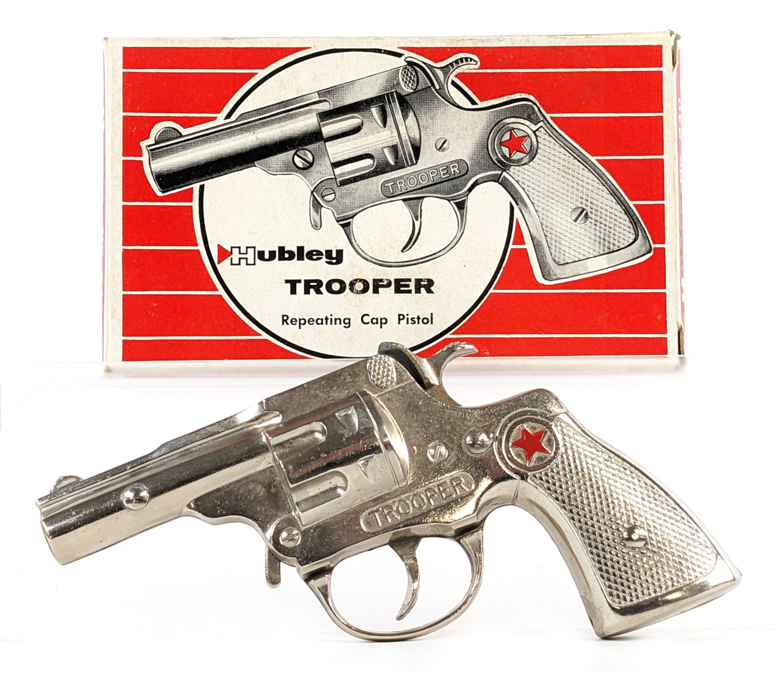 Hubley Trooper Repeating Cap Pistol Gun w/ Box: Hubley Trooper repeating cap pistol gun with original box. The gun is in excellent condition. It does have the usual minor corrosion to the hammer. Good working order. The box is very straight and cle