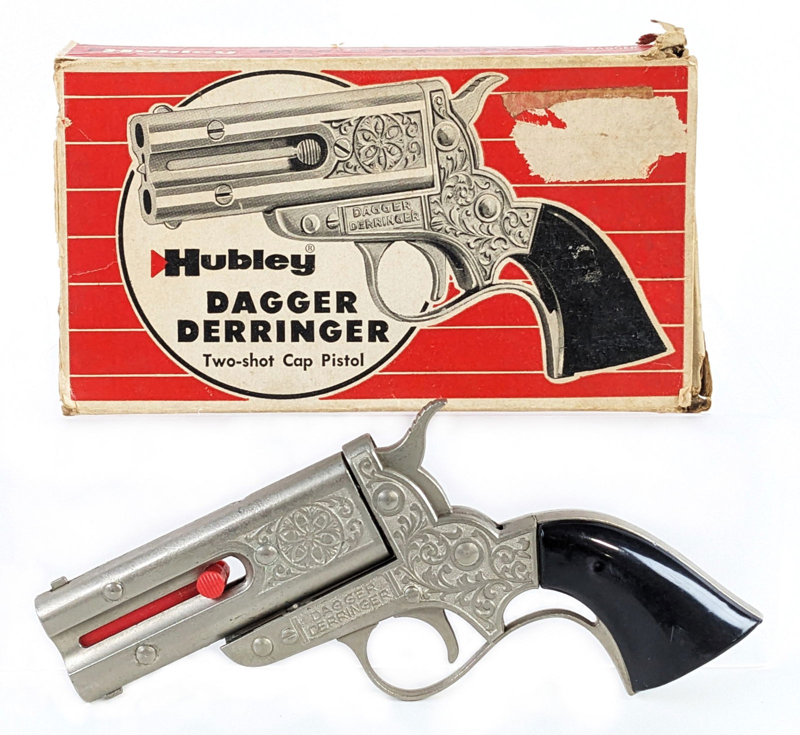 Hubley Dagger Derringer Two-Shot Cap Pistol w/ Box: Hubley dagger derringer two-shot cap pistol with original box. The box is missing all of the flaps besides one of the main ones. The grips have a little play, but are fully attached. The gun works as