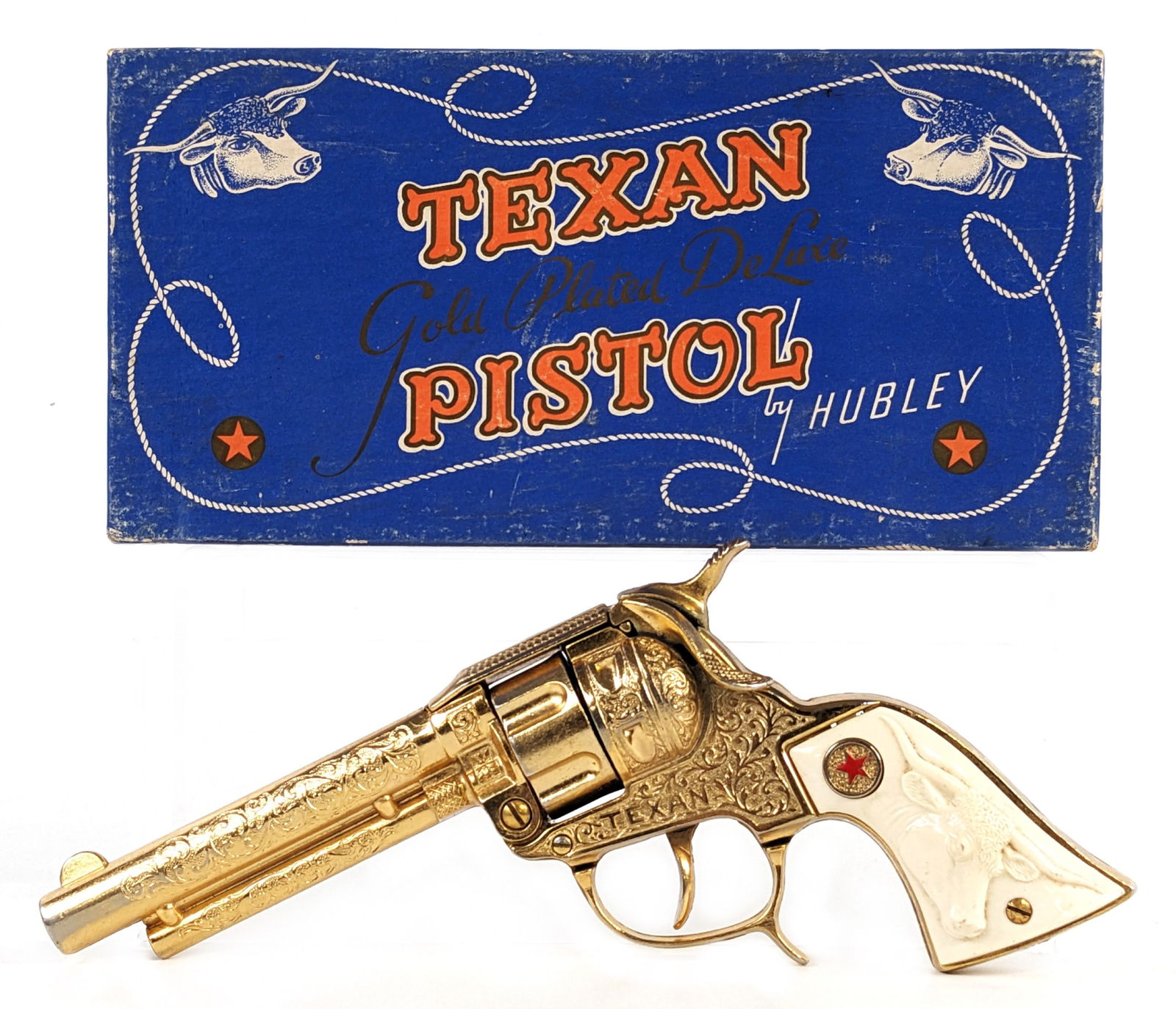 Hubley Texan Gold Plated Deluxe Pistol Cap Gun w/ Box: Hubley Texan gold plated deluxe pistol with original box. The gun has some minor plate loss and light corrosion to the hammer. The box has some color loss. Overall a very nice harder to find gold plat