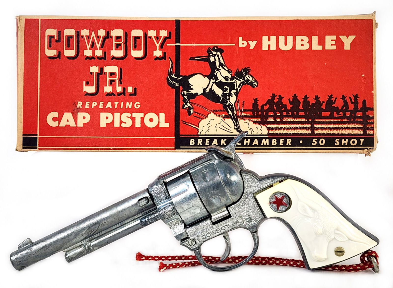 Hubley Cowboy Jr. Repeating Cap Pistol Gun w/ Box: Hubley Cowboy Jr. repeating cap pistol with the original box. The cap gun is in excellent condition. The box has a couple punctures and is missing some of the small flaps. The gun measures 8-1/2" long