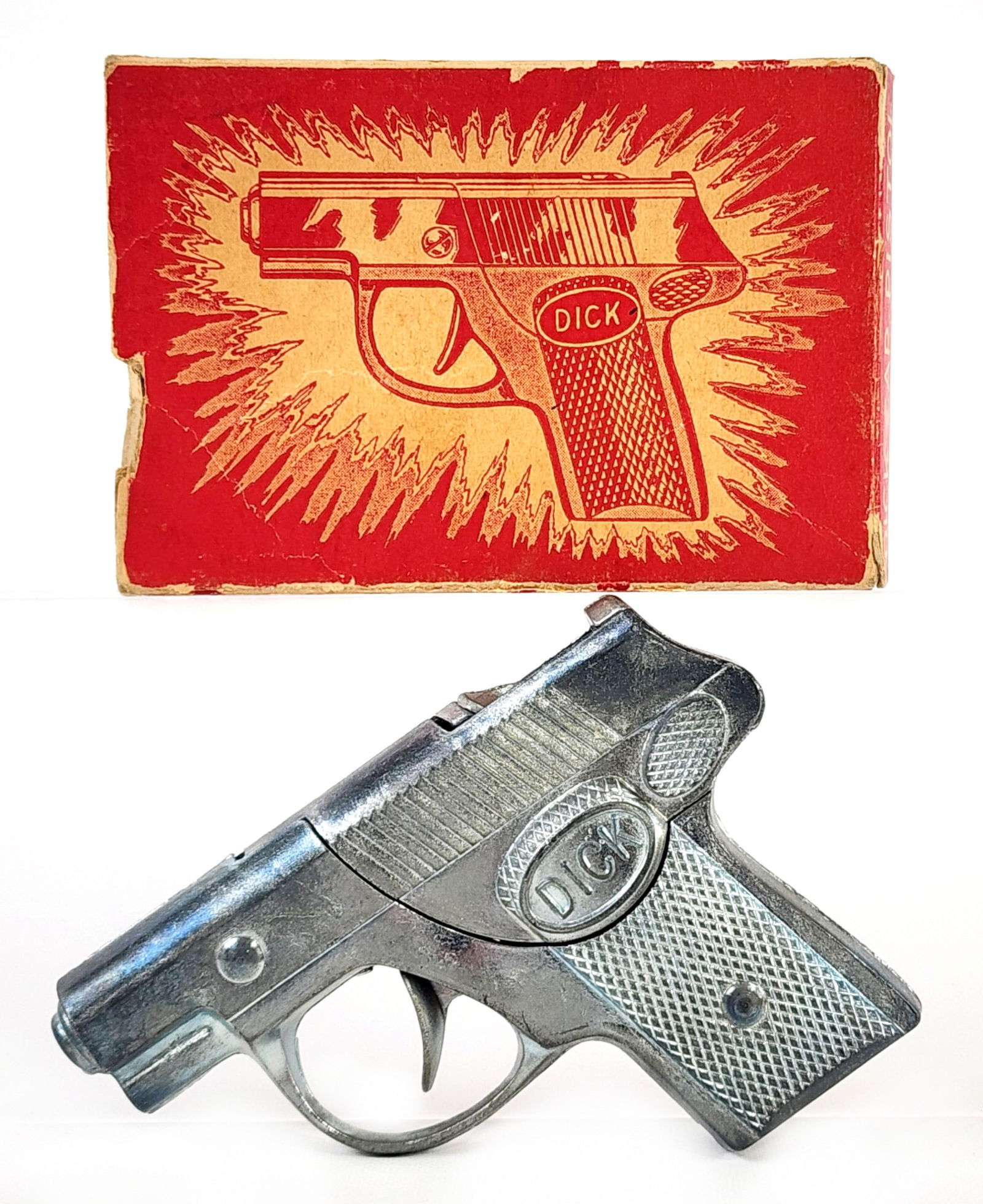 Hubley "Dick" Cap Gun Pistol w/ Box: Hubley "Dick" cap gun pistol with the original box. The gun is in excellent working condition. The box is missing all of the end flaps on the one end. Gun measures 4" long.