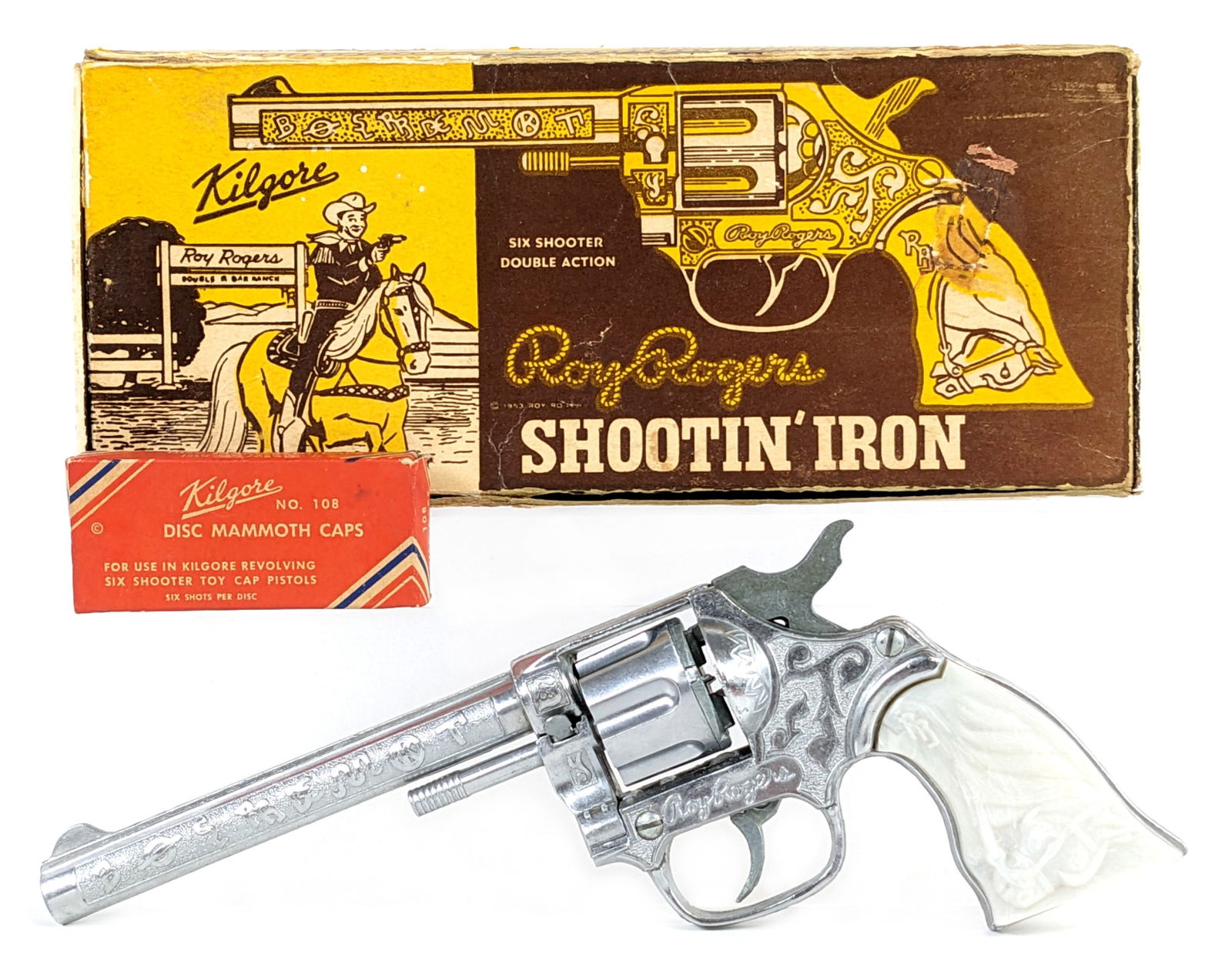 Kilgore Roy Rogers Shootin' Iron Cap Gun Pistol w/ Box: Kilgore Roy Rogers Shootin' Iron cap gun pistol with the original box. The gun is in excellent condition and works. The box has some repairs, tape, and wear from age. Displays well overall. Measures 9