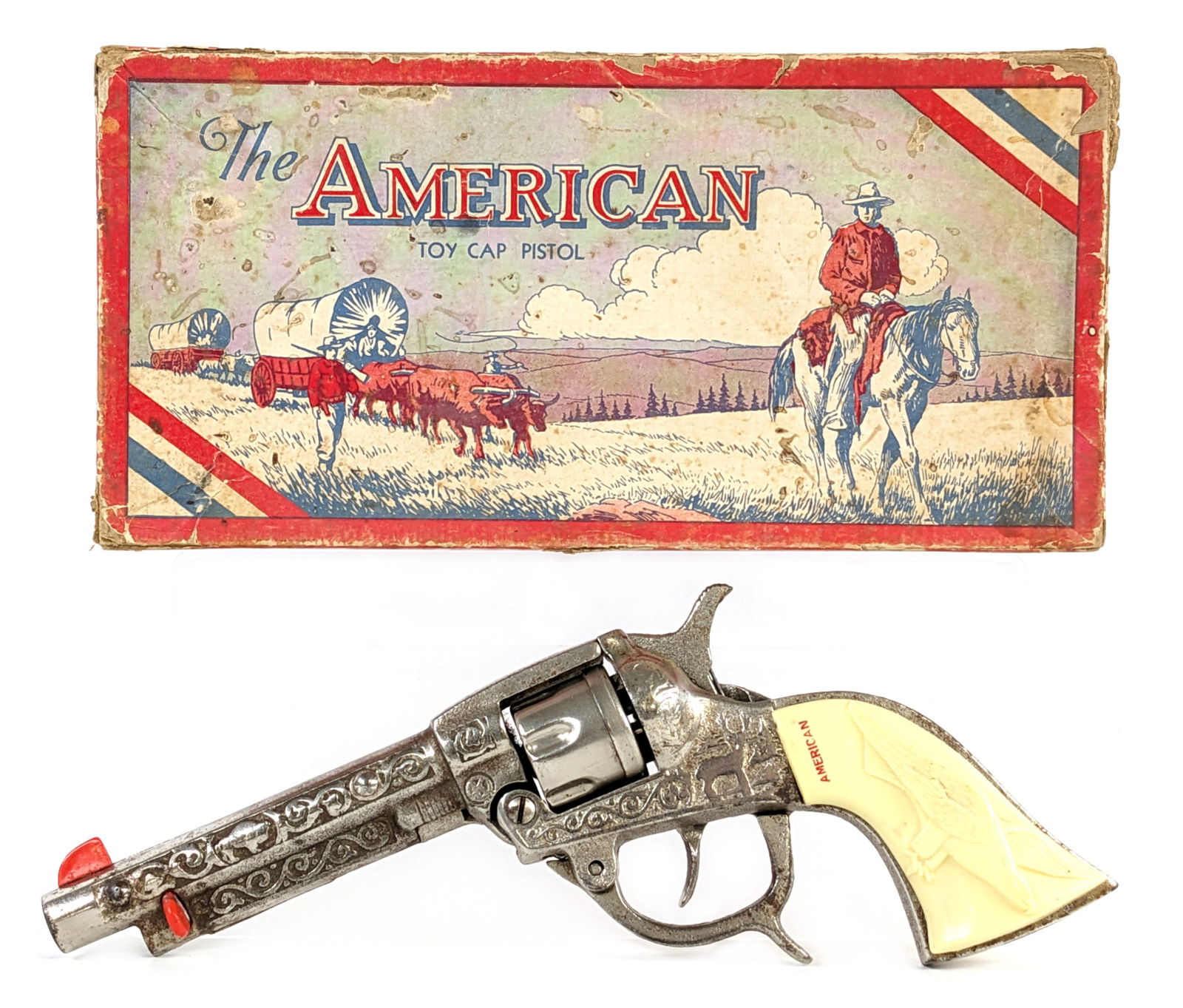 Kilgore American Cap Gun Pistol w/ Box: Kilgore American revolver cap gun pistol with the original box. The gun has a crack in the left side grip in the eagles wing. The gun is in good working condition. The box has some staining, edge wear