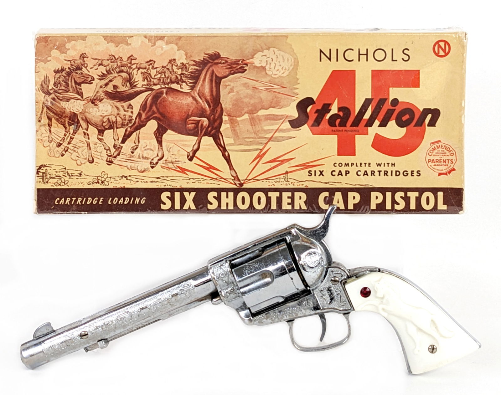Nichols Stallion 45 Six Shooter Cap Pistol Gun w/ Box: Nichols Stallion 45 six shooter cap pistol gun with the original box. The gun has some plate loss and light wear from use / age. The box was wrapped in plastic wrap to help preserve it. Overall a grea