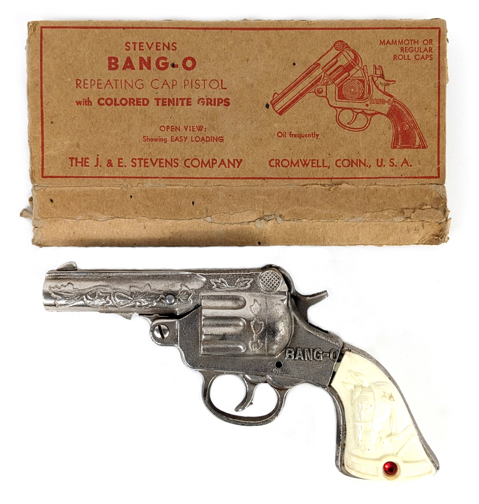 Stevens Bang-O Repeating Cap Pistol w/ Box: J. & E. Stevens Bang-O repeating cap pistol with the original box. The box is in rough condition. The gun has some yellowing around the grips and light wear from use. The gun works as it should. Measu