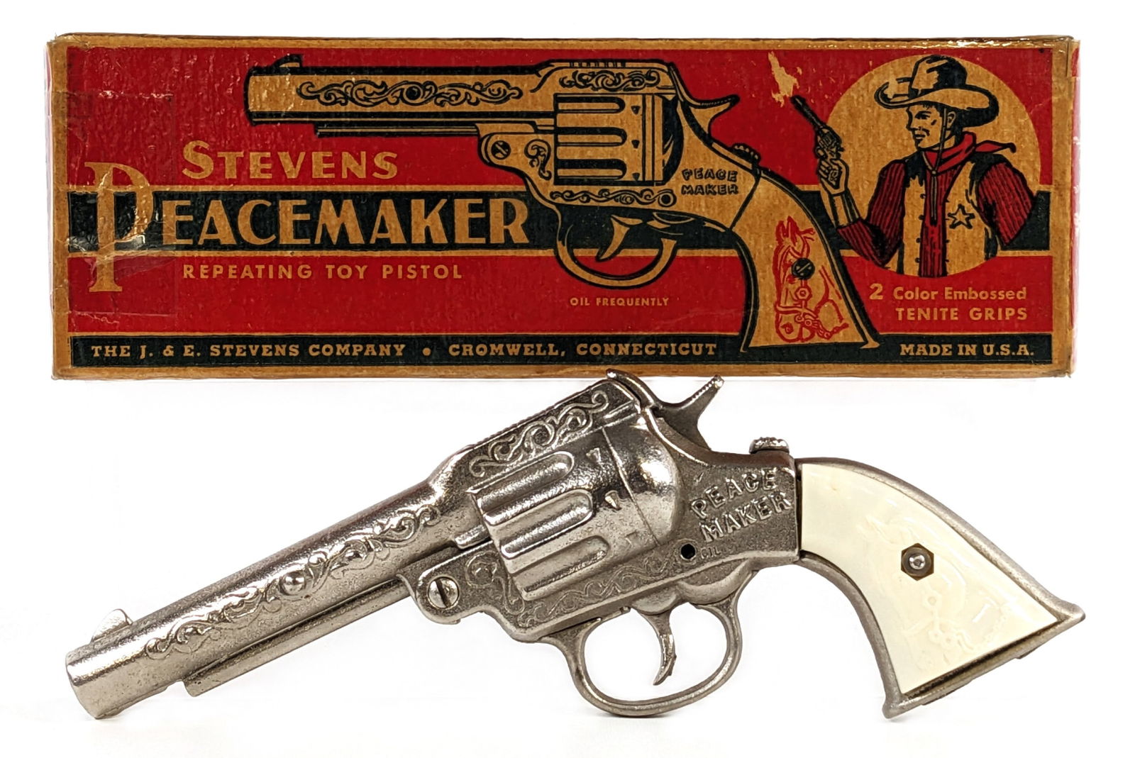 Stevens Peacemaker Cap Gun Pistol w/ Box: J. & E. Stevens Peacemaker cap gun pistol with the original box. The cap gun is in excellent condition and almost looks unplayed with. The gun works as it should. The box has been restored with tape a