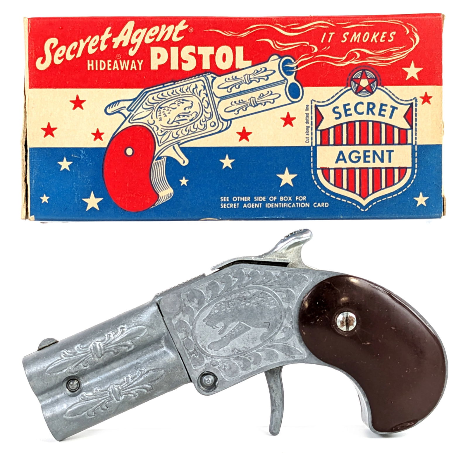 Hamilton Secret Agent Hideaway Cap Gun Pistol w/ Box: Hamilton Specialties Inc. Secret Agent Hideaway cap gun pistol with the original box. The cap gun is in very good condition and appears to work as it should. The box has one loose small flap and minor