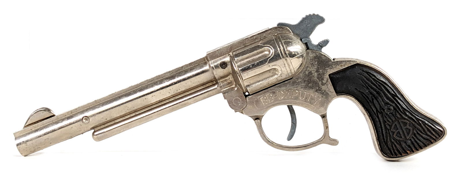 Geo. Schmidt BB Deputy Cap Gun Pistol: Geo. Schmidt BB Deputy cap gun pistol. The pistol is in excellent condition. It appears to function as it should. The gun shows some light wear from age. Measures 8-1/2" long.