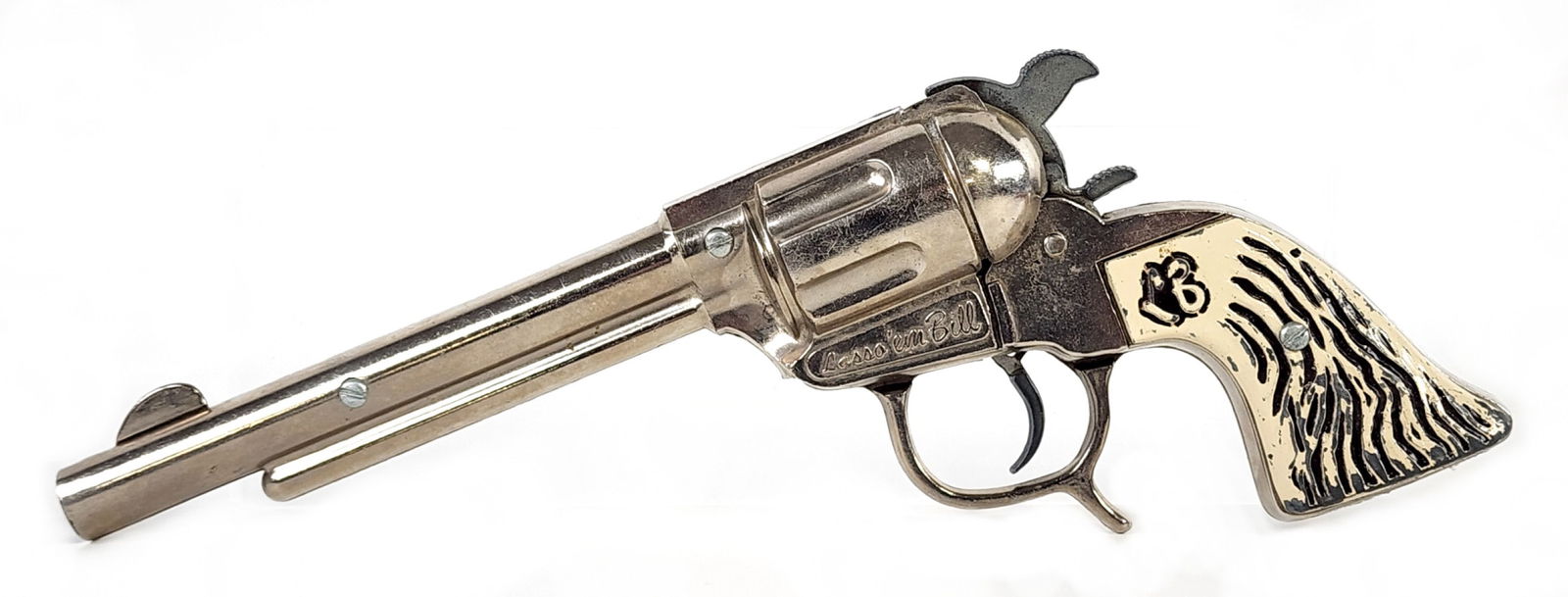 Geo Schmidt Lasso'Em Bill Cap Gun Pistol: Geo. Schmidt Lasso'Em Bill cap gun pistol. The grips show some loss and the gun has light age wear. It functions as it should. Measures 9-1/2" long.