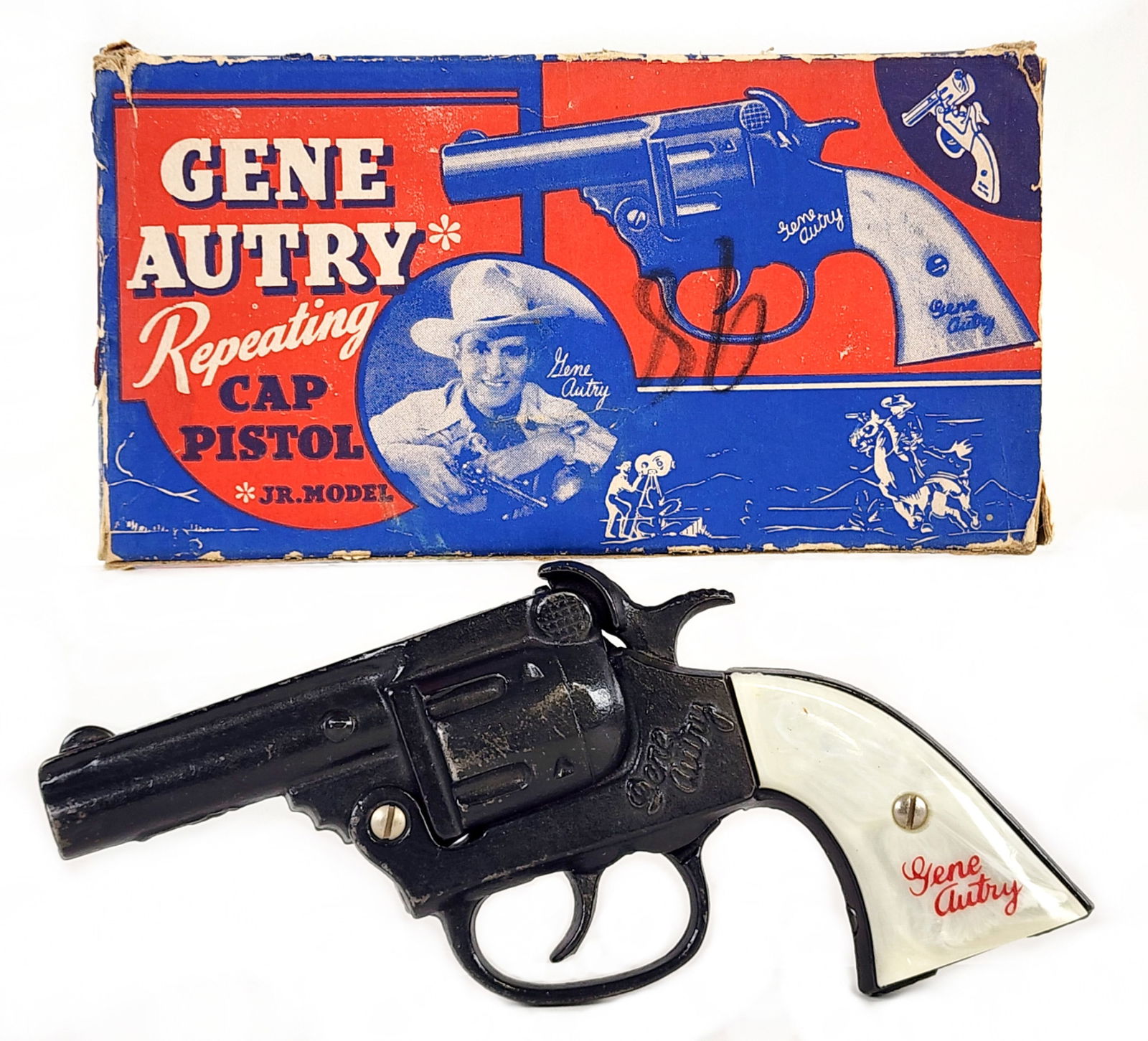 Kenton Gene Autry Cap Gun Pistol w/ Box: Kenton cast iron Gene Autry cap gun pistol with the original box. The gun has some very minor wear from age and overall is in excellent condition. The gun works as it should. The box is fairly rough w