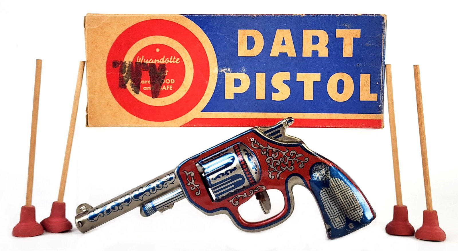 Wyandotte Dart Pistol w/ Darts In Box: Wyandotte dart pistol with four darts in the original box. The gun is in very good condition and works. The gun has some scratches and light use wear. The box has some staining, but is complete with a