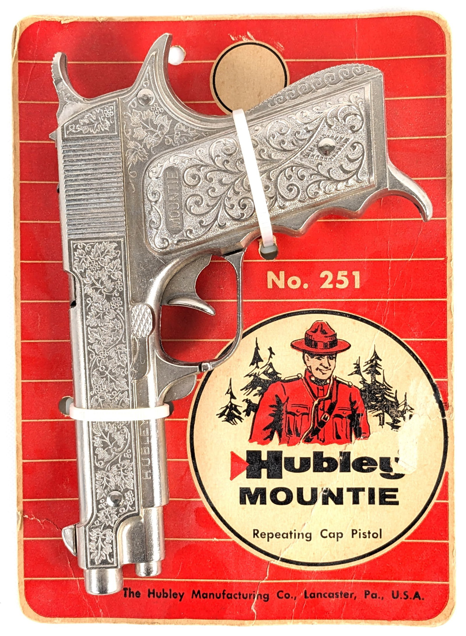 Hubley Mountie Cap Gun Pistol w/ Package: Hubley Mountie cap gun pistol on original card. The zip ties are believed to not be original. The gun functions as it should. The card has some pealing and creasing from storage and handling. Measures