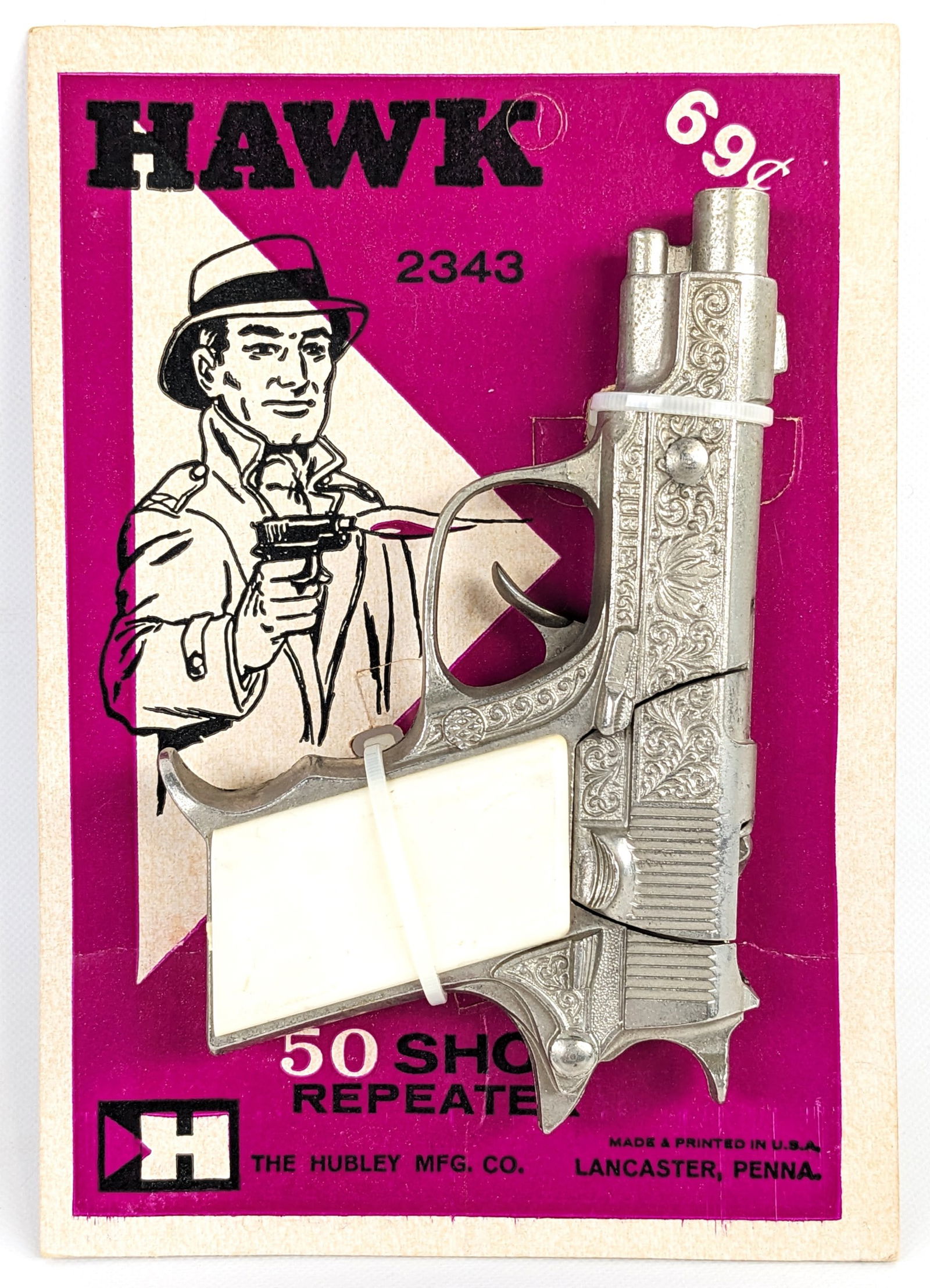 Hubley Hawk 50 Shot Repeater Cap Gun Pistol w/ Package: Hubley Hawk cap gun pistol on the original card / package. The card is unpunched and very clean overall. The gun works as it should. The grips show some minor scuff marks. The card measures 7" tall by