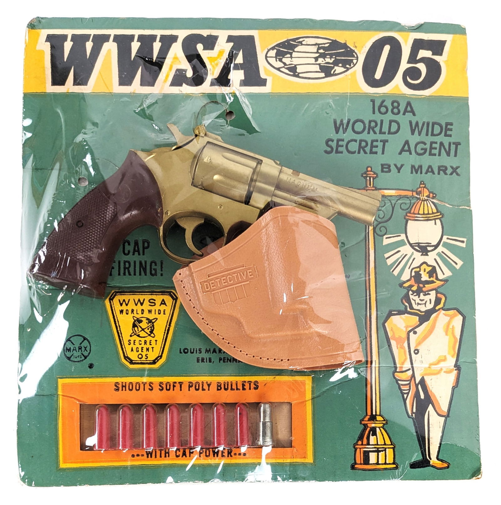 Marx World Wide Secret Agent WWSA 05 Cap Gun Set In Package: Marx World Wide Secret Agent cap gun set in the package. The set includes a magnum revolver, detective holster, and soft poly bullets. It looks like someone put a piece of cardboard on the back of the