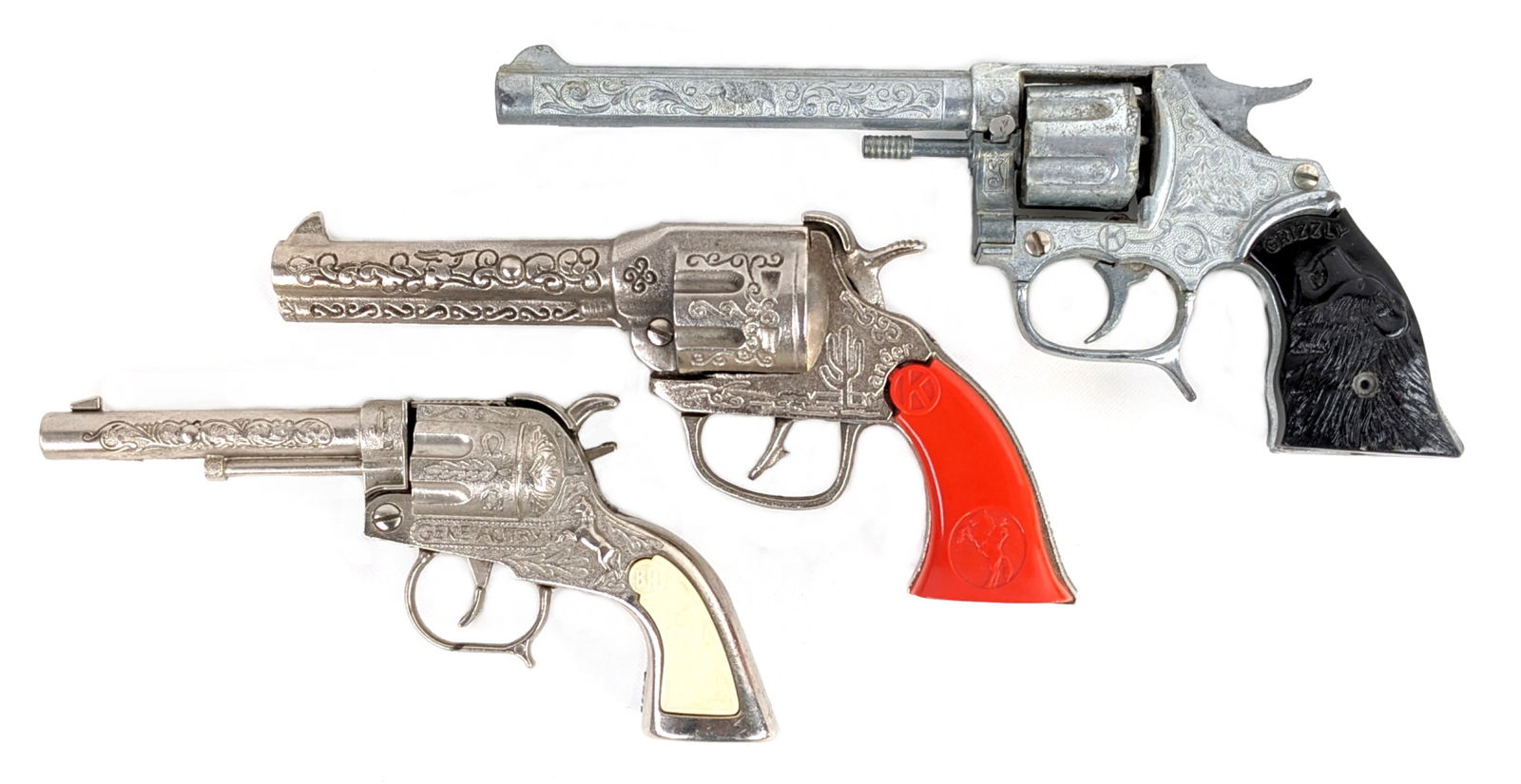 Kilgore Ranger, Kilgore Grizzly, & Buzz Henry Gene Autry Cap Guns: Includes a Kilgore cast iron Ranger cap gun, Kilgore Grizzly revolver cap gun, and a Buzz Henry Gene Autry cap gun. All appear to function as they should. Overall very nice condition. The Grizzly has