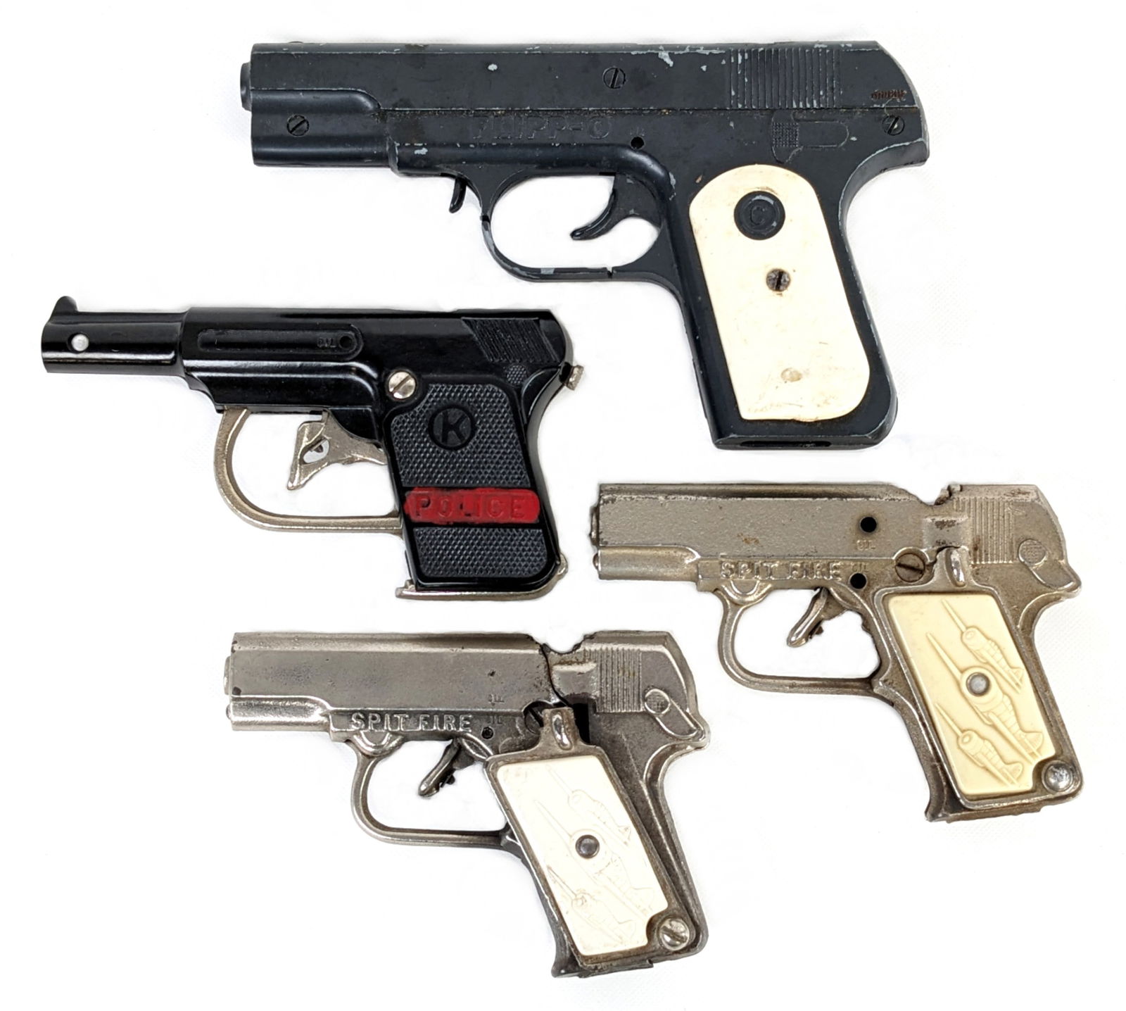 Kilgore Police, (2) Stevens Spit Fire, & Flipp-O Cap Guns: Includes a Kilgore police pistol, (2) Stevens Spit Fire pistols, and Flipp-O cap gun pistols. The one grip plate on the one Spit Fire is damaged. The trigger for the Flipp-O does stick. All vary in ag