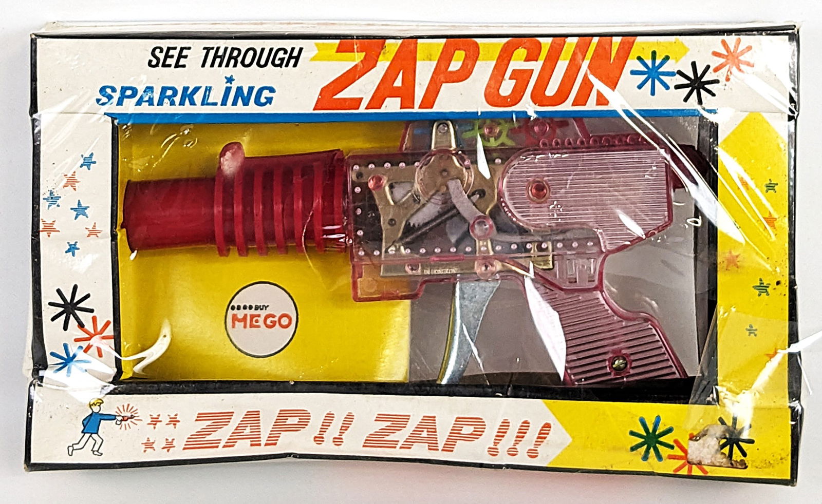 MEGO Sparkling Zap Space Gun NIB: Vintage MEGO see through sparkling zap space gun in the original box. There is a tear in the original plastic on the box. The gun has never been played with, however there is a crack in the barrel of