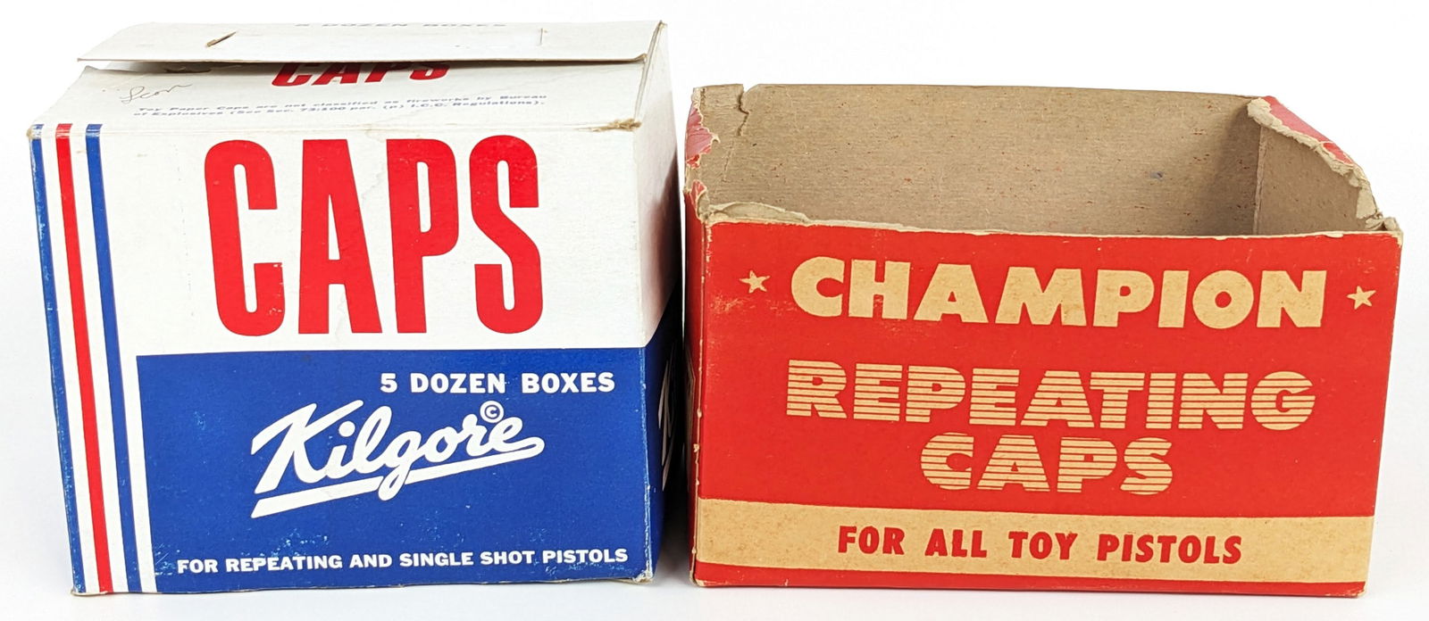 Kilgore & Champion Caps For Cap Guns: Includes a case of Kilgore caps containing 60 boxes and a partial case of Champion repeating caps containing 22 boxes. The case boxes show wear. The individual boxes are in good condition.