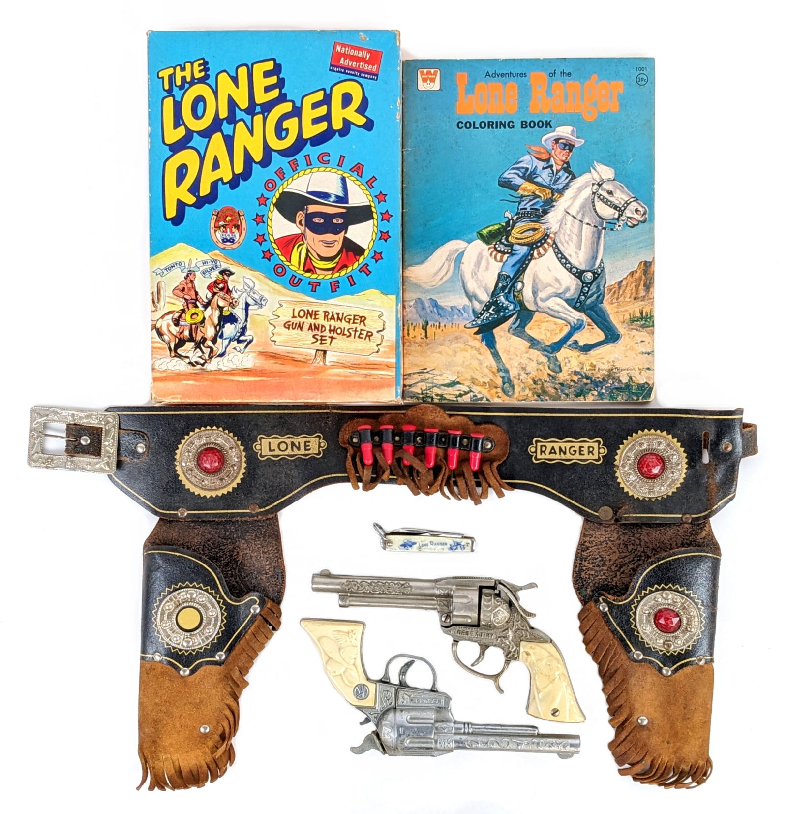 Esquire Novelty Co. Lone Ranger Holster Set w/ Book & Knife: Esquire Novelty Co. The Lone Ranger official outfit, coloring book, and pocket knife. The outfit includes a Ranger cap gun, Gene Autry cap gun, and Lone Ranger leather holster in the original box. Bot