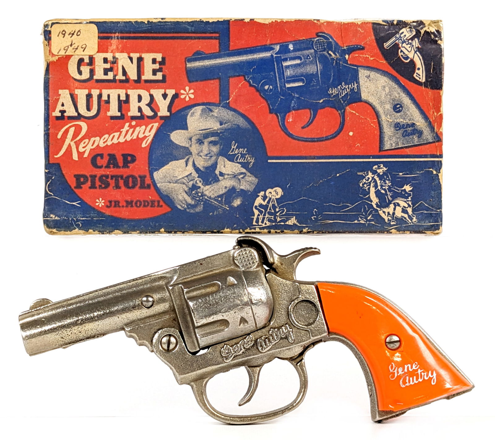 Kenton Cast Iron Gene Autry Cap Gun Pistol w/ Box: Kenton cast iron Gene Autry cap gun pistol with the original box. The cap gun has a chip out of the one grip and is cracked. The gun shows minor oxidation but functions as it should. The box is missin