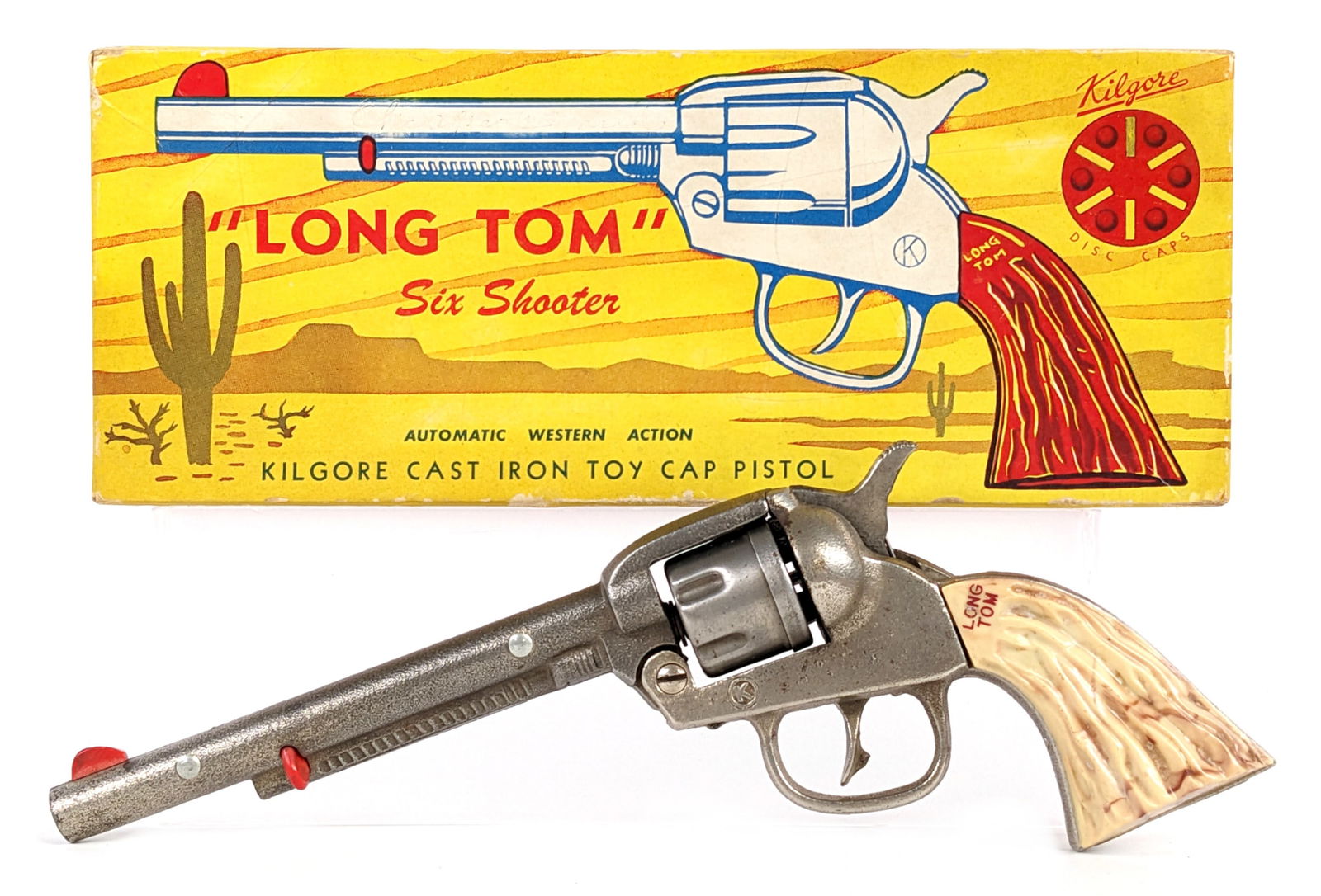 Kilgore Long Tom Six Shooter Cap Gun Pistol w/ Box: Kilgore "Long Tom" six shooter revolver cap gun pistol with the original box. The cap gun is in good working condition. The left side grip shows some discoloration. The box has some edge wear. Display