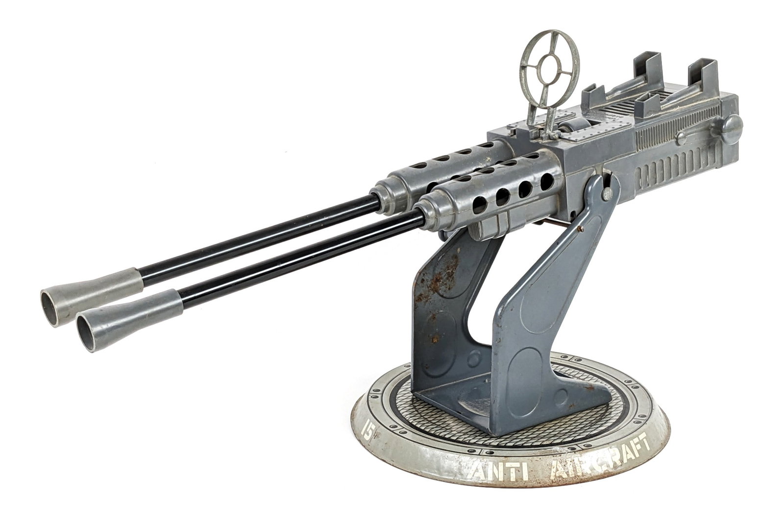Marx Twin Pom-Pom Anti-Aircraft Cannon: Marx Twin Pom-Pom Anti-Aircraft Cannon gun. The cannon has some discoloration, dust, scuff marks, and wear from play / age. It appears to function as it should. Measures 21" across.