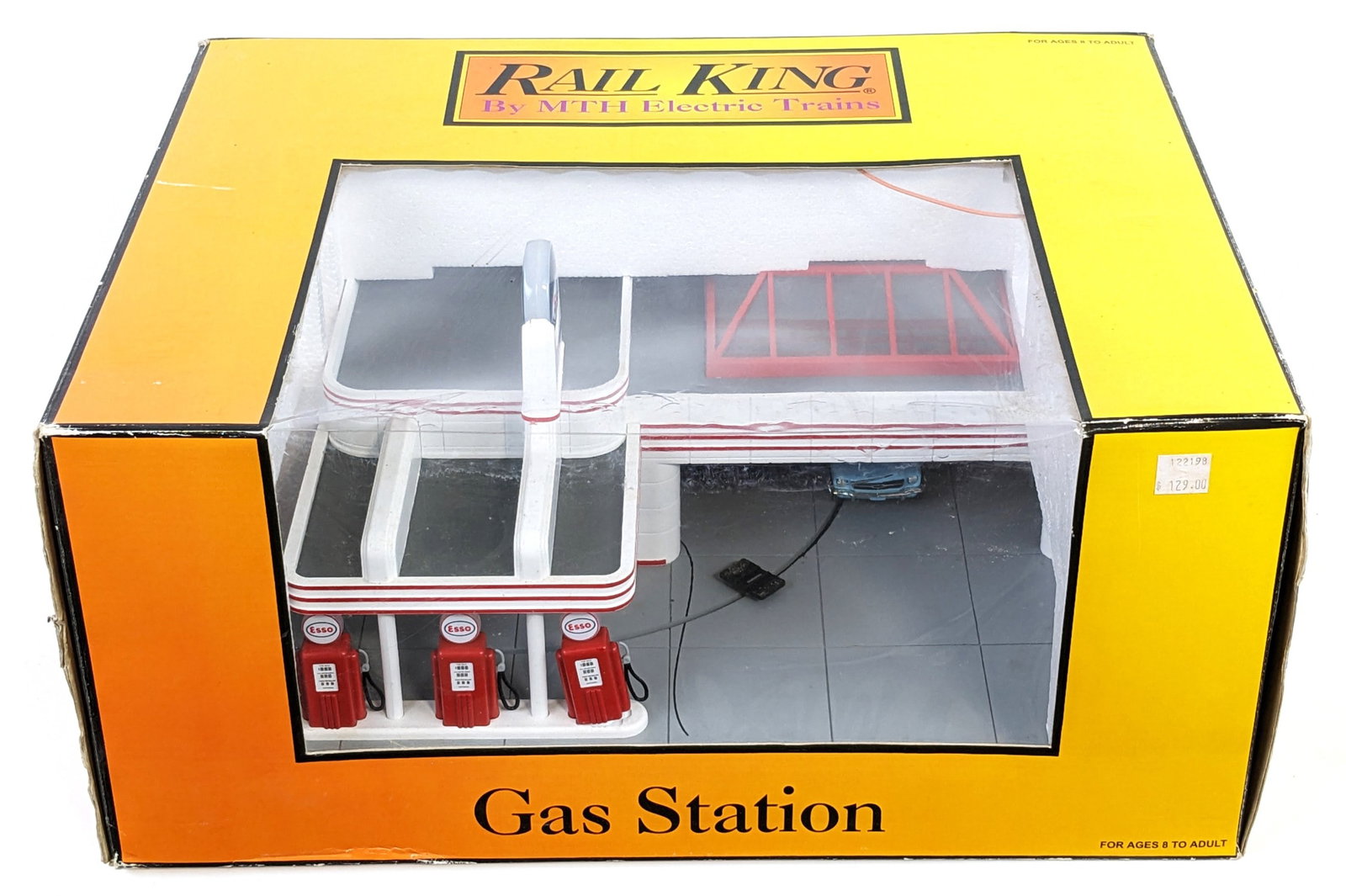 MTH Esso Operating Gas Station 30-9106: MTH Esso operating gas station #30-9106. The Mustang is loose in the box. The station shows dust and wear from use / display. The box measures 17" by 13" by 8".