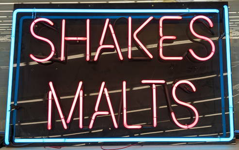 Custom Shakes & Malts Neon Sign: Custom Shakes & Malts neon advertising sign. It features an acrylic back and 2-color neon. Nice working condition with some scratches and wear from display and storage. Measures approximately 43in acr