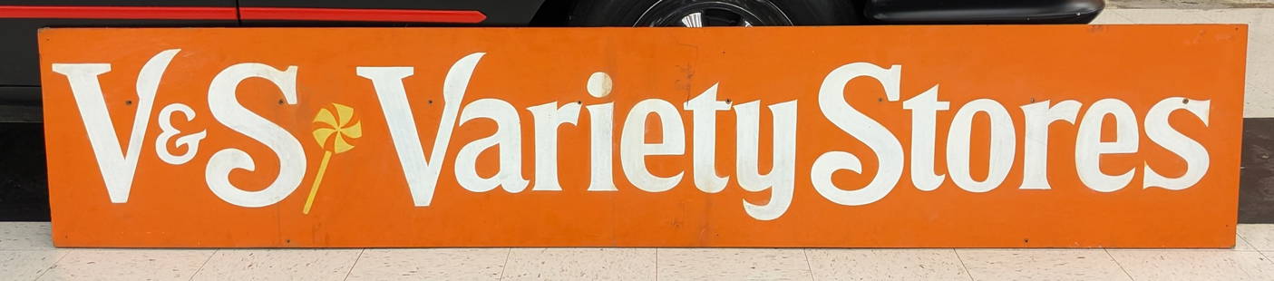 8ft Vintage SSW V&S Variety Stores Sign: Large single sided wood V&S Variety Stores advertising sign. Has paint loss, weathering to wood, and other wear from use and age. Measures approximately 8ft across by 18in tall.