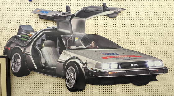 7ft Custom Back To The Future DMC Delorean Sign: Custom 7ft Back To The Future DMC Delorean Time Machine sign. Has scratches, and other wear from display. It measures approximately 7ft across by 4ft tall.