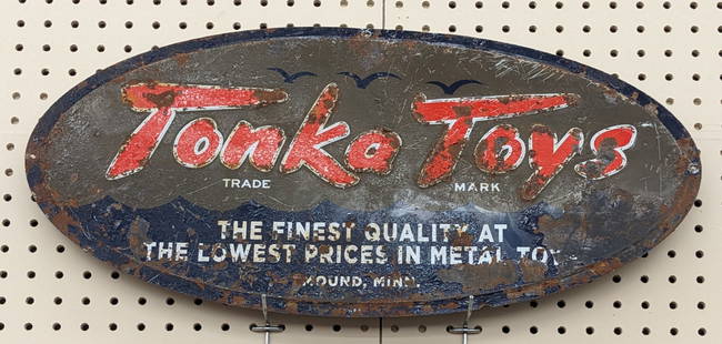 Scarce Vintage SST Tonka Toys Adv Sign: Hard to find vintage single sided metal Tonka Toys advertising sign. Worn condition with flaking paint, rust, and other wear from age. Still displays well. It measures approximately 24in across by 12i