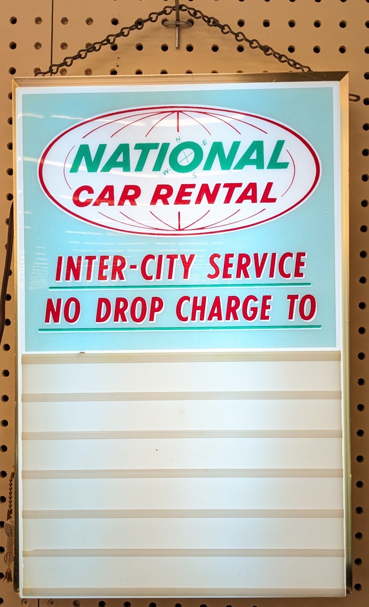 Vintage National Car Rental Lighted Sign: Vintage National Car Rental Lighted advertising sign by Tel-A-Sign. Appears to be in nice working condition with some scratches and wear from use and age. Measures approximately 18-1/2in tall by 12in 