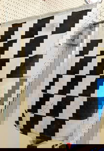 2004 Denver Grand Prix Signed Checkered Flag: 2004 Denver Grand Prix signed checkered flag with ticket stub. Has discoloration and wear from display and age. Not including the wood handle it measures approximately 31in across by 24in wide