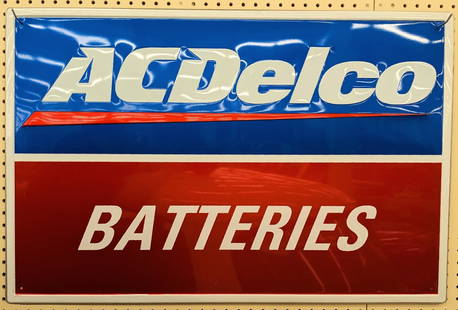 SST AC Delco Batteries Embossed Advertising Sign: Single sided tin embossed AC Delco Batteries advertising sign. Appears to be in nice condition with light scratches and wear from display. It measures approximately 3ft across by 2ft tall.