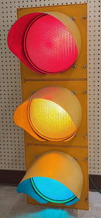 Durasig Stop Light Street Signal Sign: Durasig Stop Light Street Signal sign. Appears to be in good working condition with some paint loss, scratches, and wear from use. It measures approximately 42in tall.