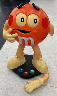3ft M&Ms Figural Store Display: Life size M&Ms Figural store display. Fair condition with yellowing, broken arm, and other damage / wear from use. Measures approximately 3ft tall.