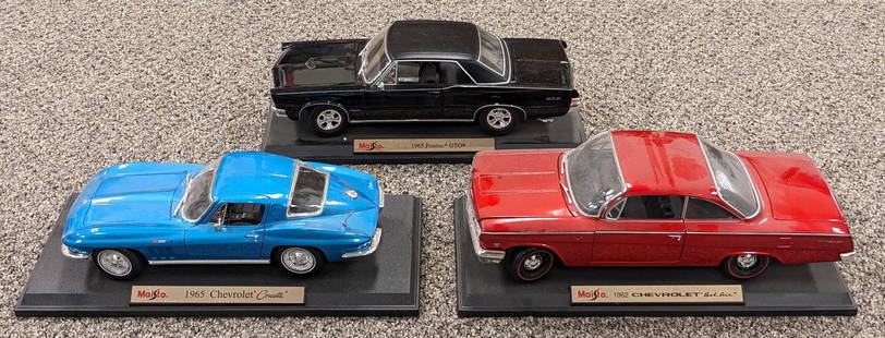 (3) Maisto Die Cast Model Cars: Includes a 1965 Chevrolet Corvette, 1965 Pontiac GTO, and 1962 Chevrolet Bel Air. Cars are in nice condition with light wear from display.