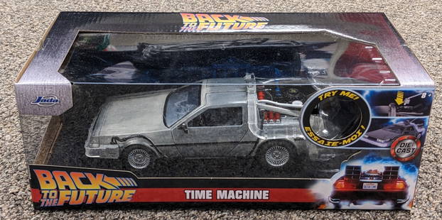 Jada Back to the Future Delorean Time Machine Die Cast Car: Car has working lights and is in nice condition with light wear on the box from handling.