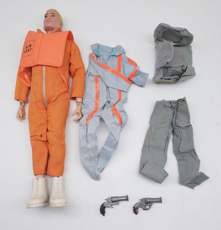 Vintage G. I. Joe Blonde Action Figure: The G.I. Joe action figure is in good condition. There is a crack on his wrist and both knees. Comes with extra accessories - there are holes on the sides of his boots.