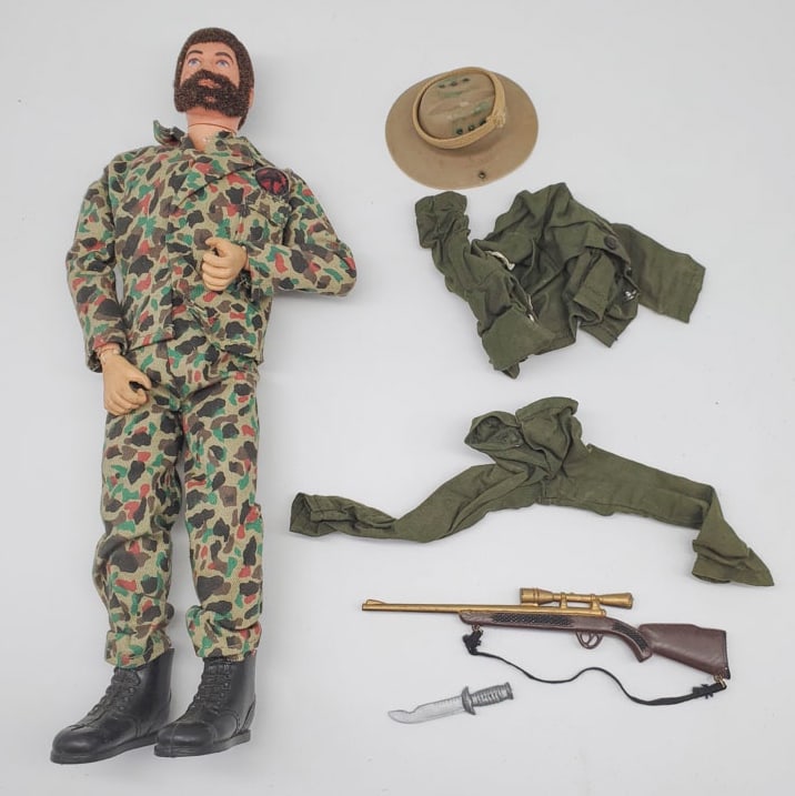 Vintage G. I. Joe Action Figure with Fuzzy Hair and Beard: The G.I. Joe action figure is in very good condition. There are no cracks or breaks on the body. Comes with extra accessories.